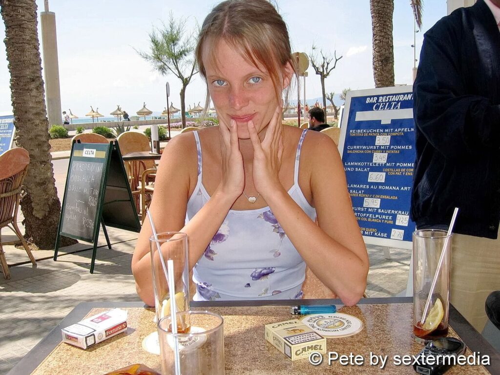 Blonde Petty pissing on the beach